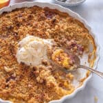 gluten free peach cobbler topped with vegan icecream