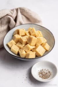 bowls with tofu and ground pepper