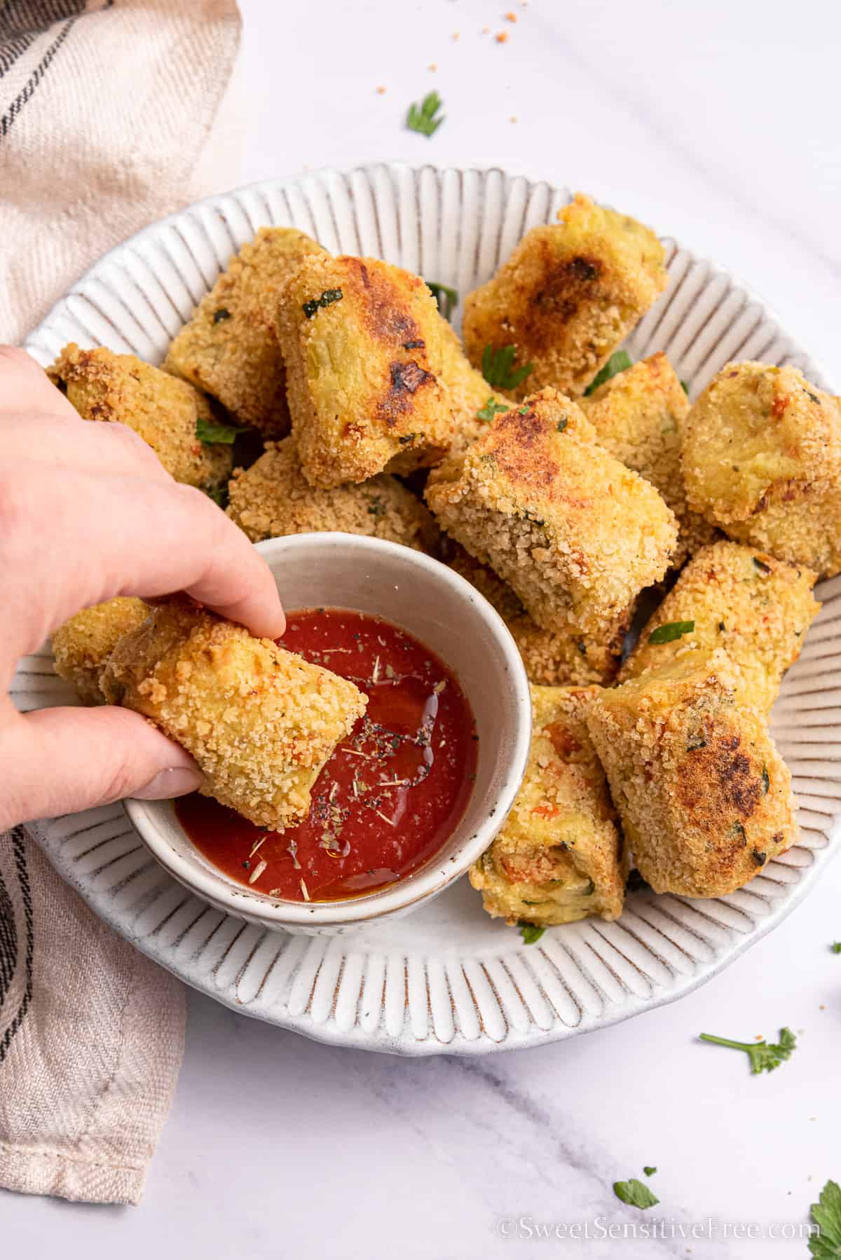 veggie tot dipped in sauce