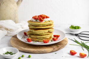 green pancakes with tomatoes chives